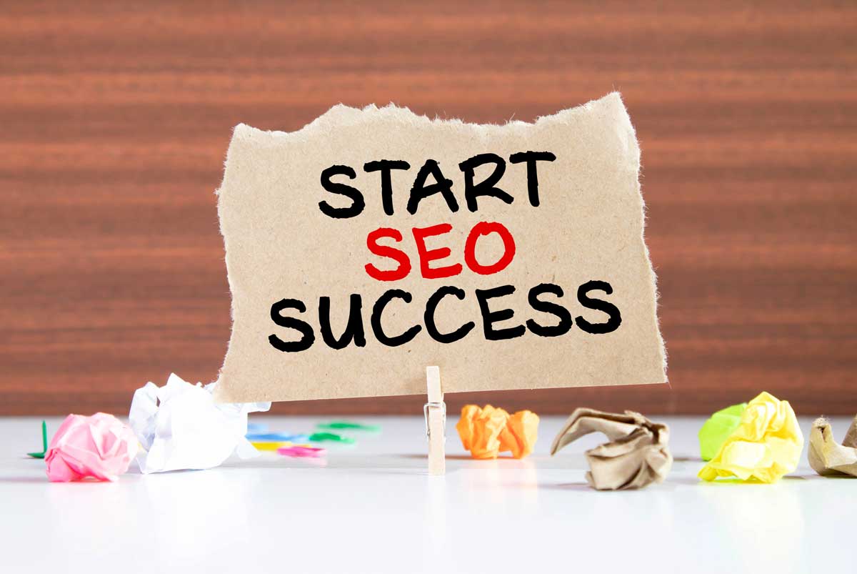 Handwriting text Start SEO Success. Concept meaning accomplishment or achievement of increasing traffic to a website Colored crumpled papers